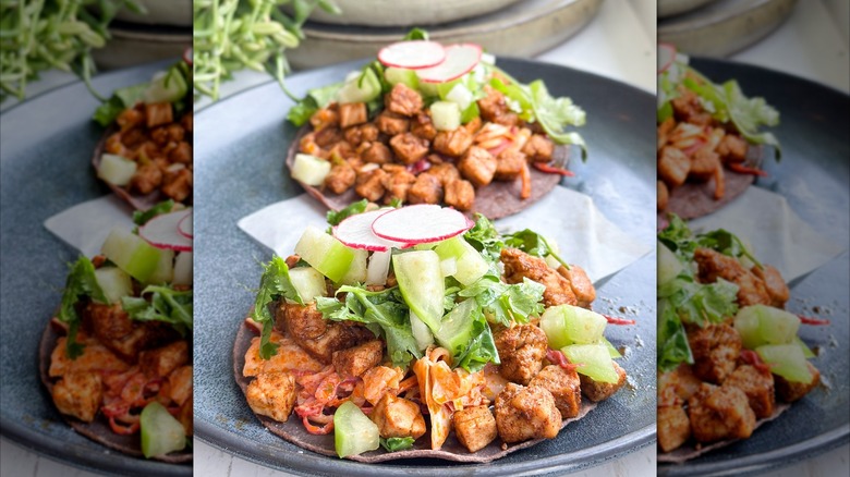 Tuna tacos on plate with slaw and radish