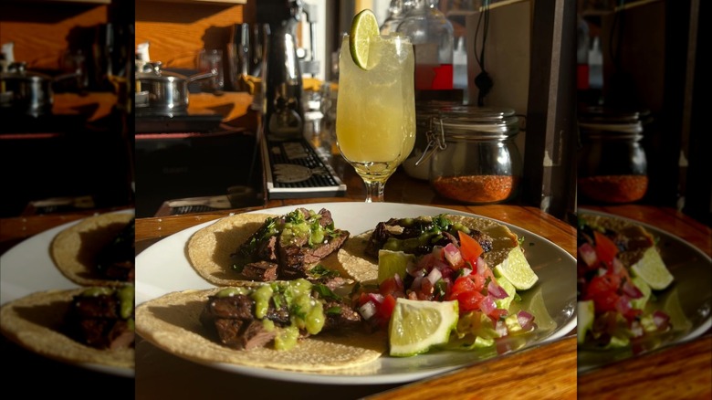 Beef tacos with pico and lime and a margarita