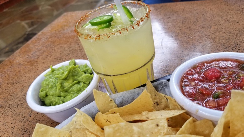 Margarita on the rocks with chips, guacamole, and salsa