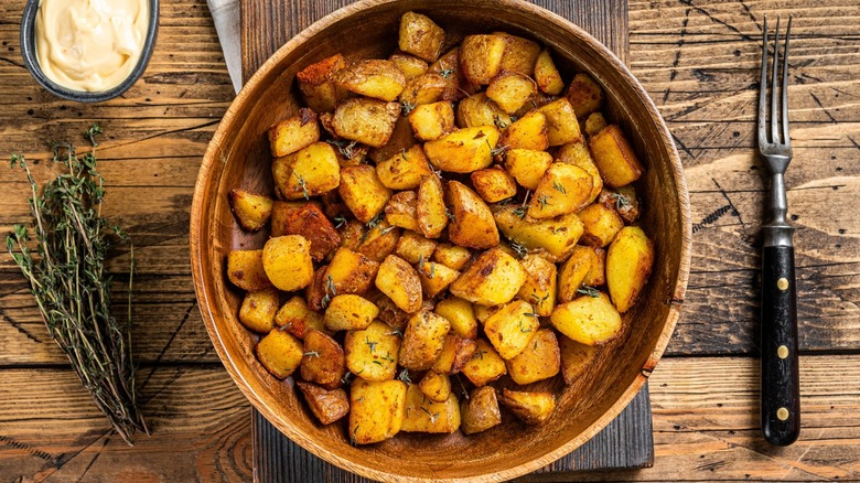 Home fries in wooden bowl