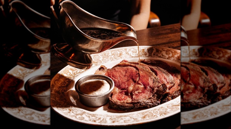 Sliced prime rib with jus and horseradish cream