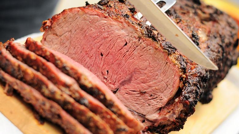 Prime rib roast being sliced