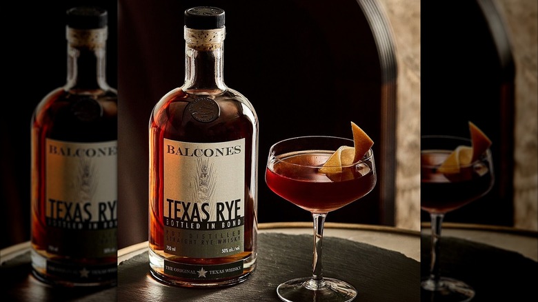 Bottle of Balcones Texas Rye with a Manhattan