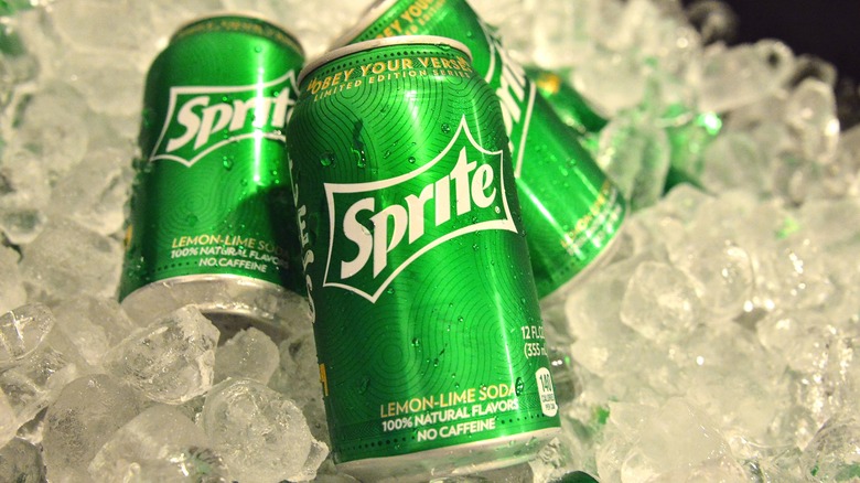 Cans of Sprite on ice cubes