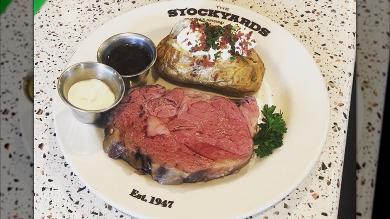 Prime rib dinner on Stockyards plate with baked potato