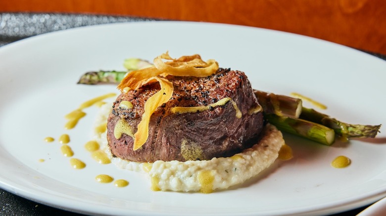 Filet on plate with asparagus and mash