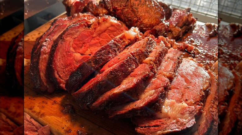 Sliced prime rib on wooden board
