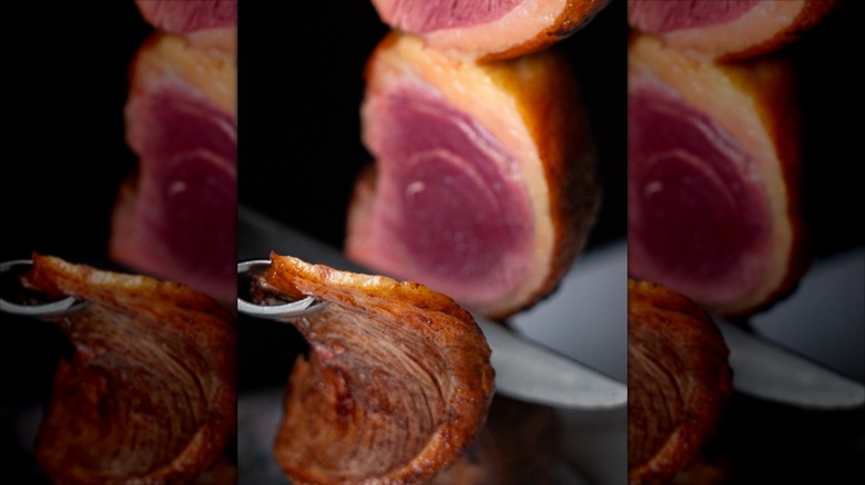 Exterior slice being cut from sirloin picanha skewer