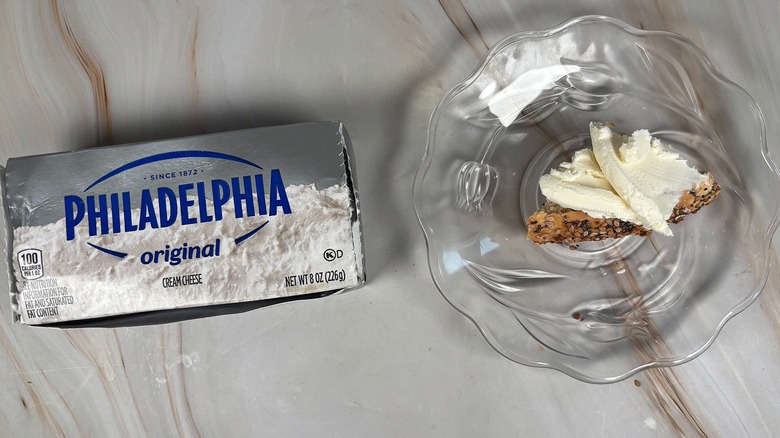 Philadelphia cream cheese box and spread on bagel