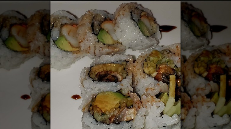 Uramaki roll topped in soy sauce