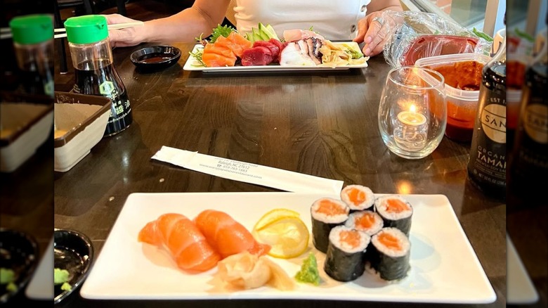 Sushi rolls and a sashimi platter