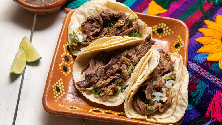 Barbacoa tacos on plate