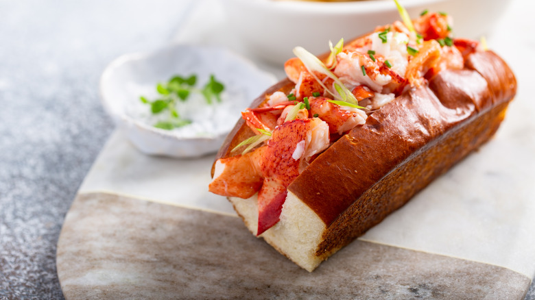A lobster roll on a board