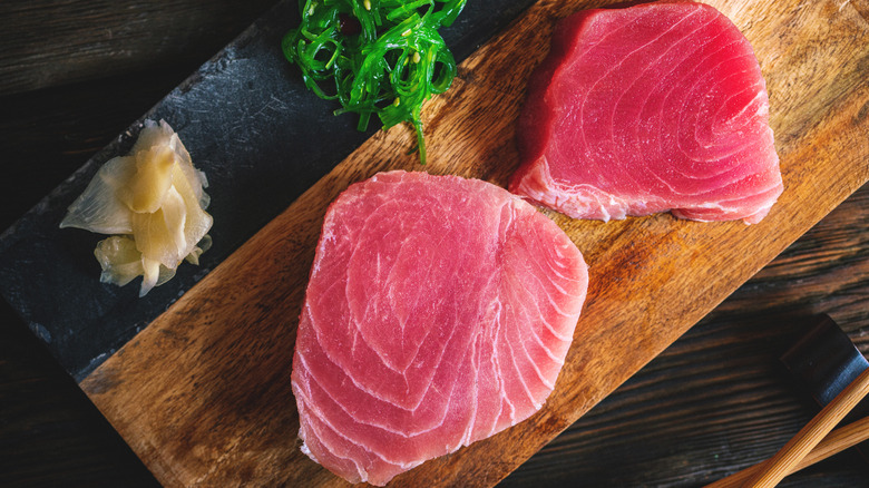 tuna steaks served on cutting board