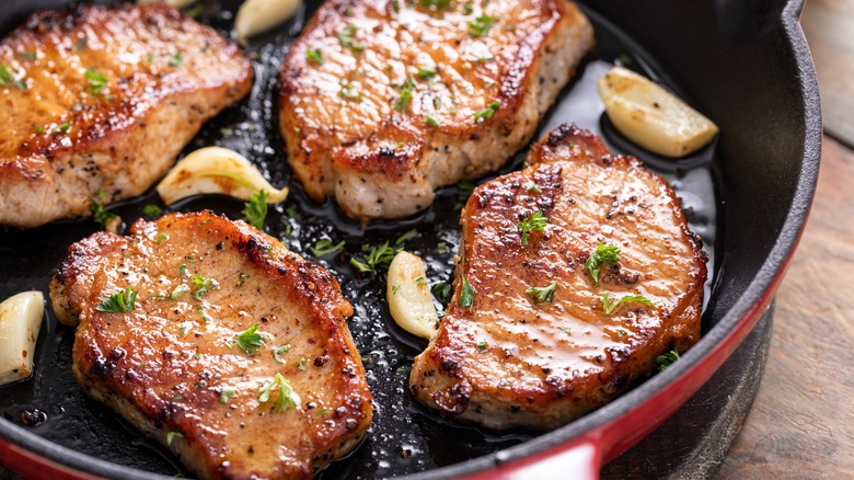 pork chops cooking with garlic