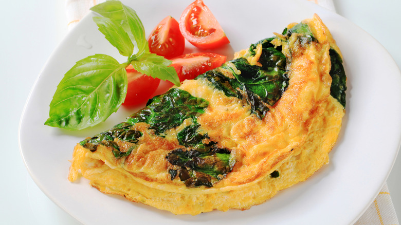 Cheese and spinach omelet on plate