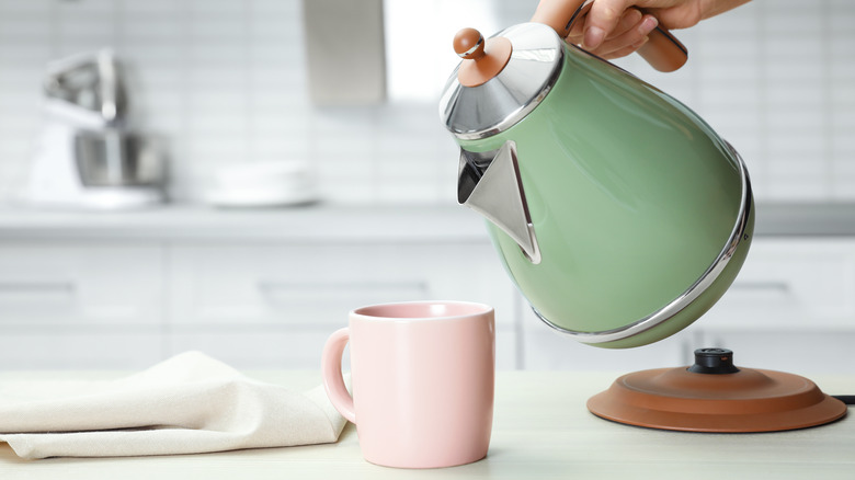 Green tea kettle and pink cup