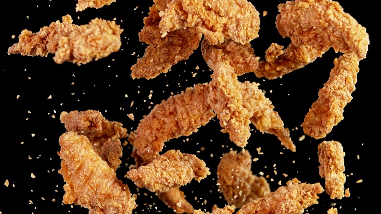 fried chicken on black background