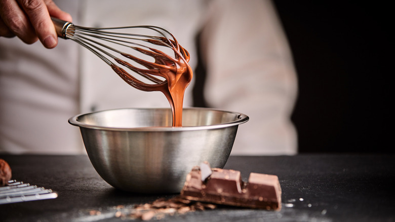 Whisking melted chocolate in a bowl