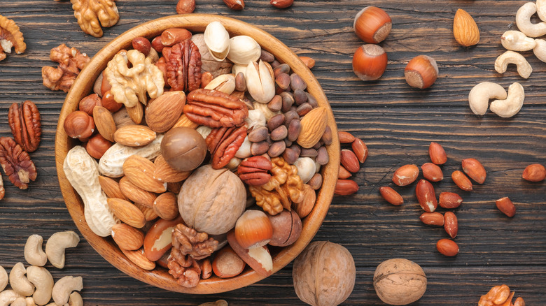 assorted nuts on wooden table