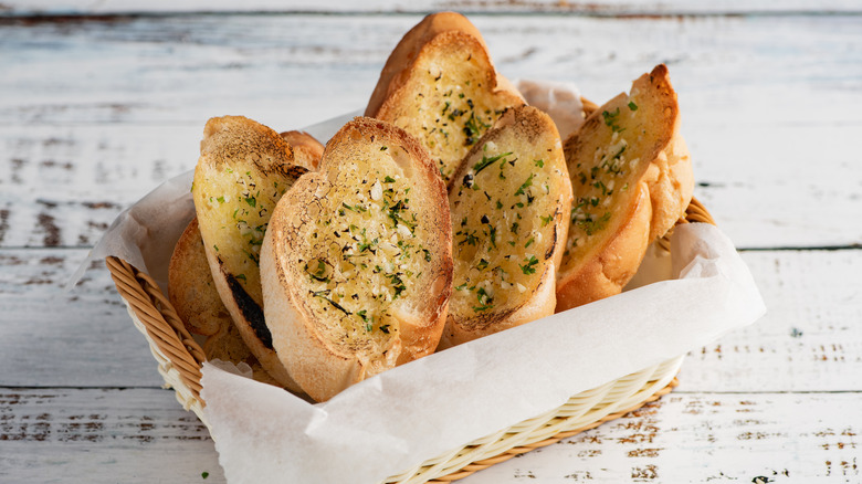slices of garlic bread in basket