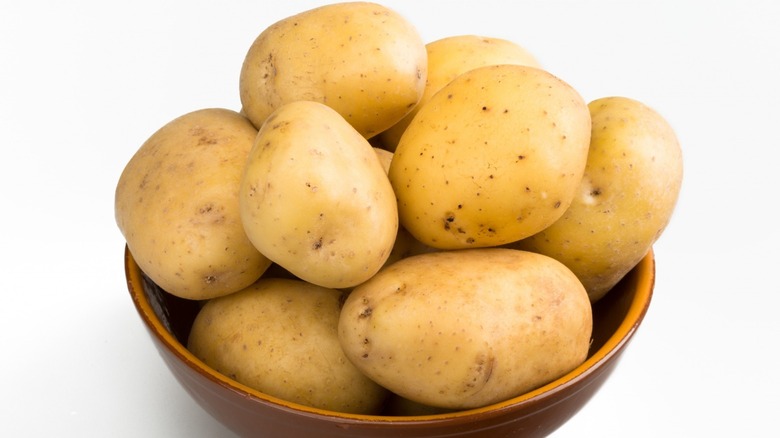 A wooden bowl of Yukon Gold Potatoes