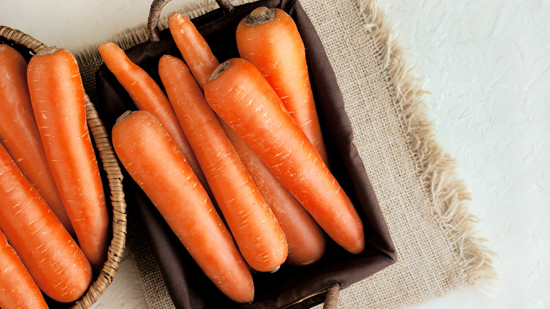 Raw carrots in basket