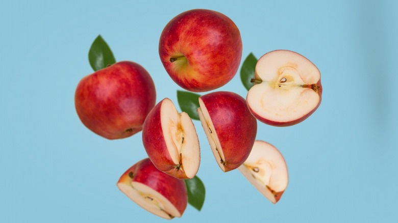 Sliced apples on blue background