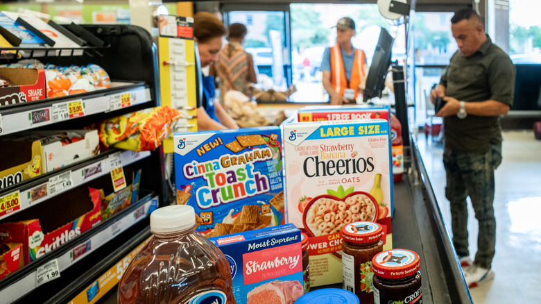 Customer checking out groceries at Kroger