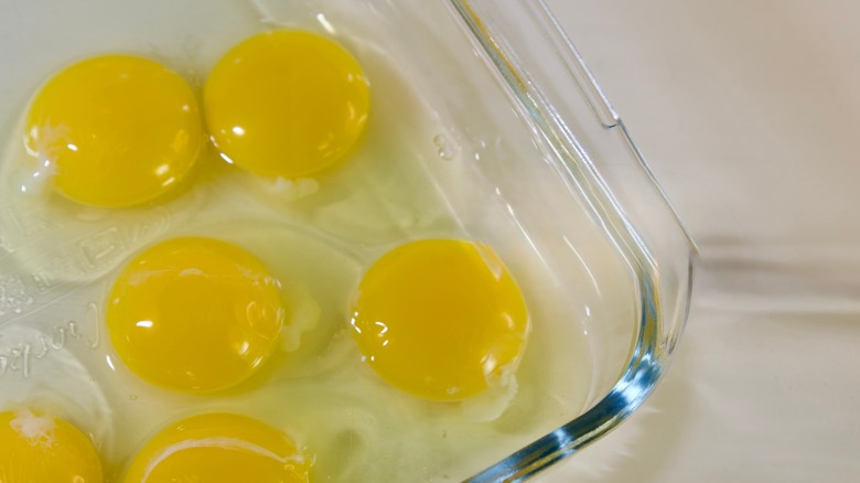 raw eggs in a glass dish