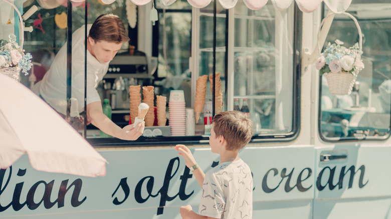 Boy buying ice cream
