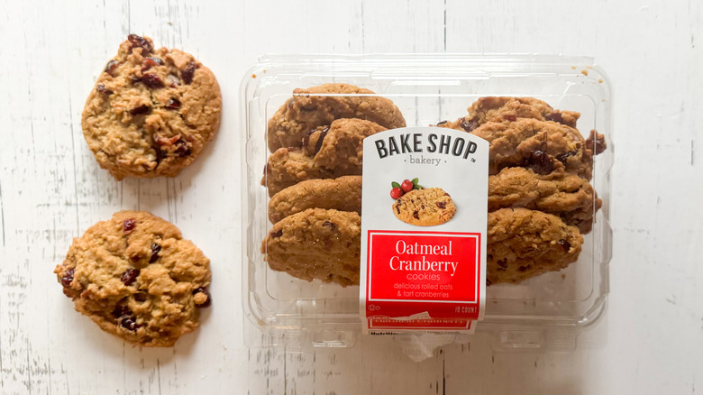 A carton of Aldi's Bake Shop Oatmeal Cranberry cookies with two of the cookies set beside it