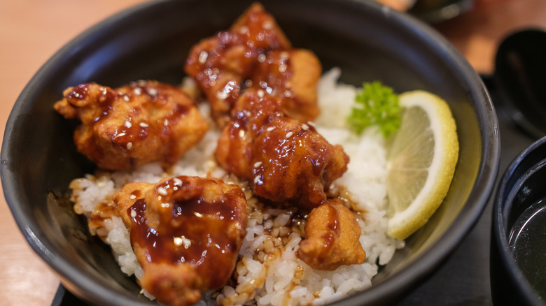 Chicken nuggets with teriyaki sauce over white rice