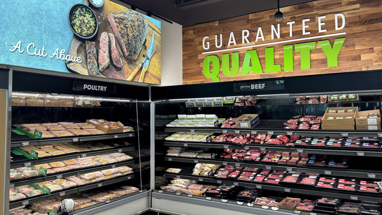 The Aldi meat section, with signs saying "A Cut Above" and "Guaranteed Quality"