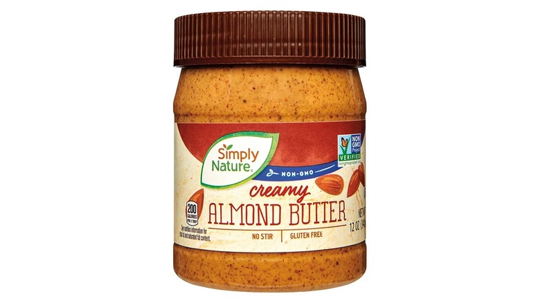 jar of Simply Nature creamy almond butter from Aldi on white background