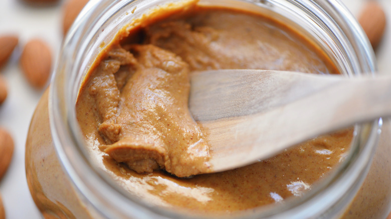 jar of nut butter with spoon