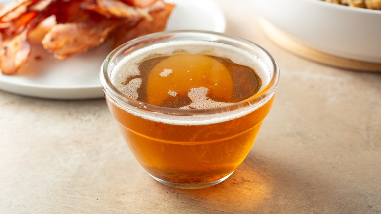 Rendered bacon fat in glass bowl