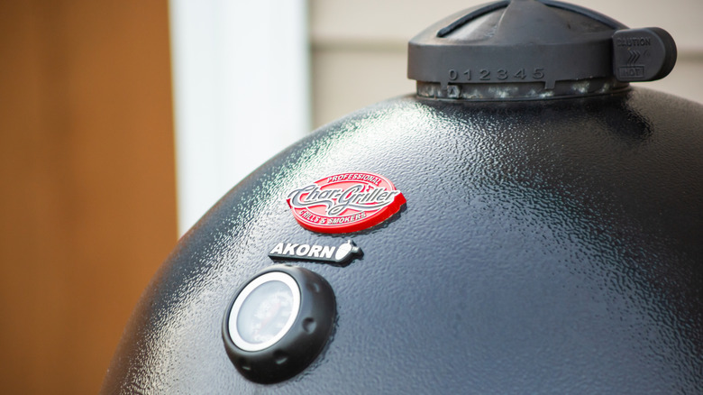 A close-up view of a black Char-Griller AKORN