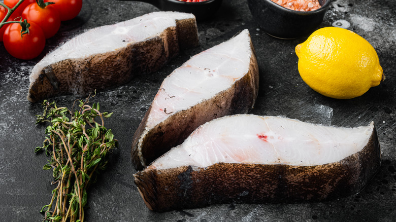 raw halibut steaks with herbs lemon and tomatoes