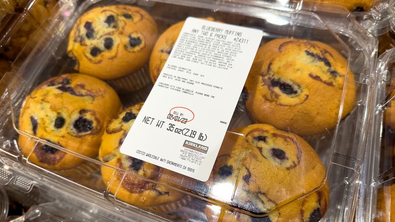 Plastic box of Costco Kirkland Signature blueberry muffins