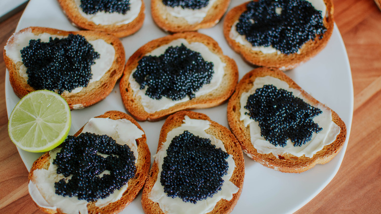 Toasts with black caviar toppings.