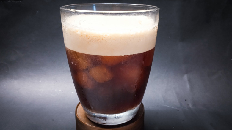 shaken iced coffee in a glass