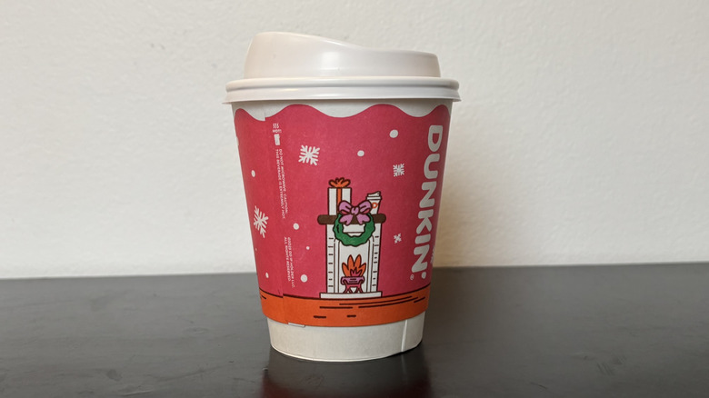 Hot Dunkin' Caramel Latte on table