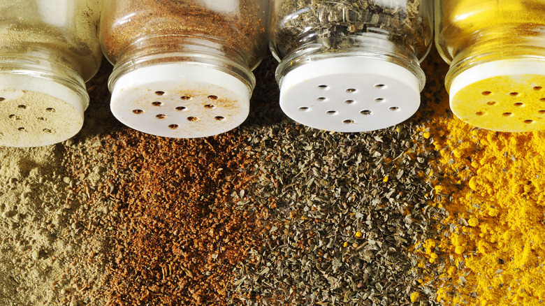 bottles of spilled spices and seasonings