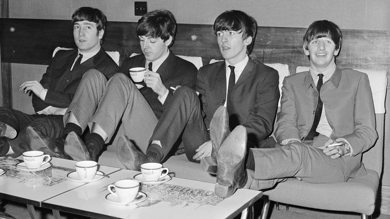 The Beatles drinking tea backstage
