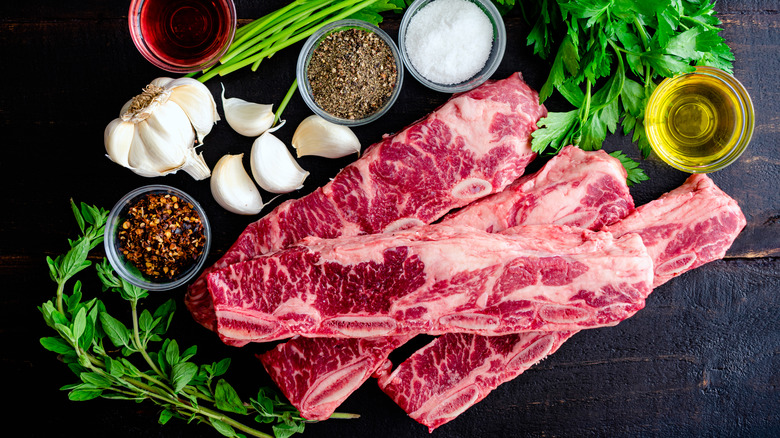 Raw flanken-style short ribs with spices and herbs.