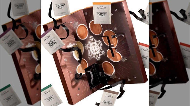 the open advent calendar with packets and ribbons floating out