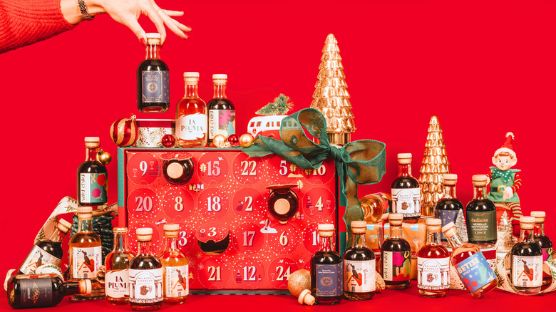 the calendar opened with bottles and ornaments all around it