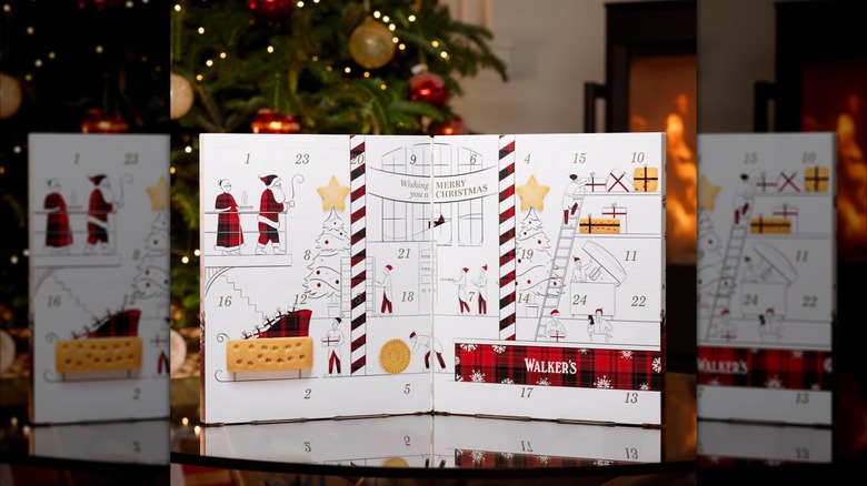 Walker's calendar opened in front of a Christmas tree