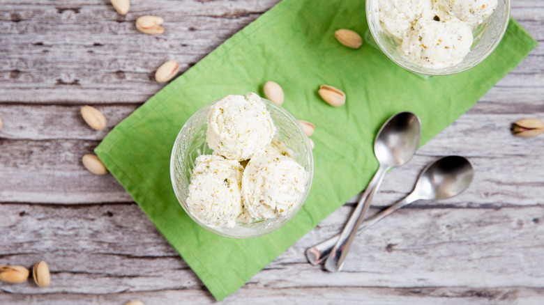 Pistachio ice cream served on table